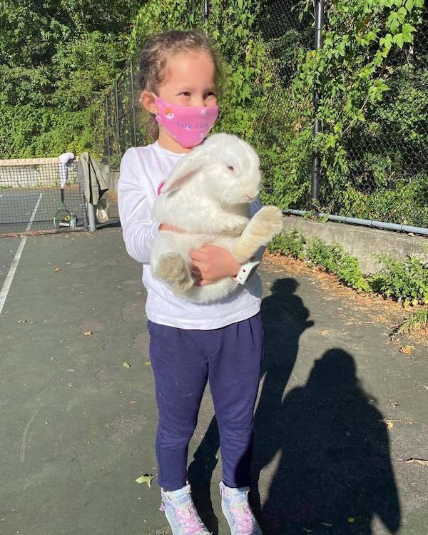 girl holding bunny